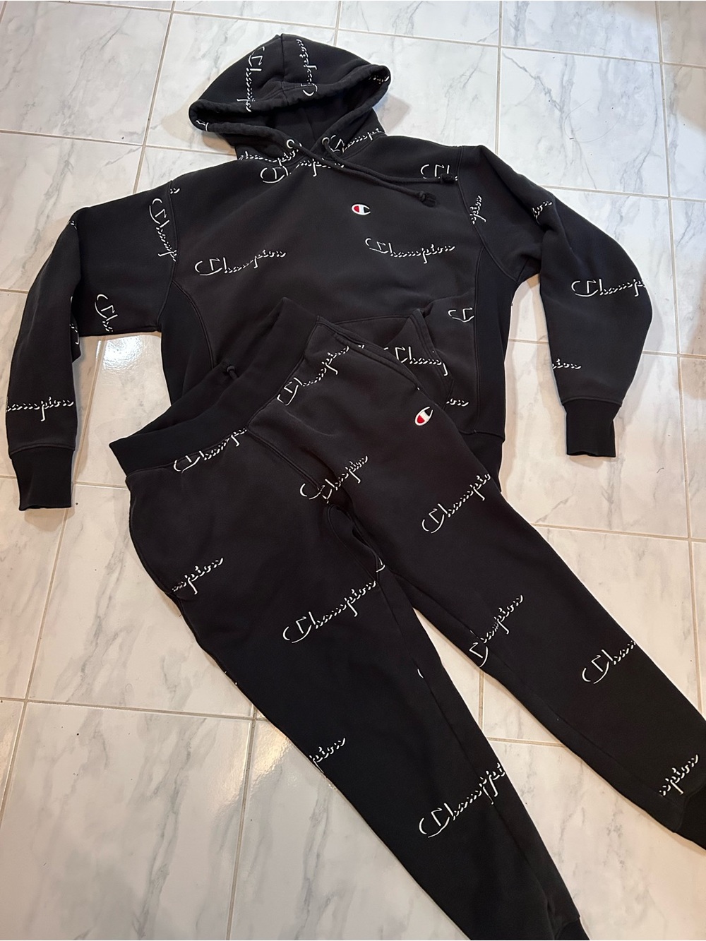 Champion Black All-Over Script Logo Hoodie & Joggers Set. Pants and sweatshirt
